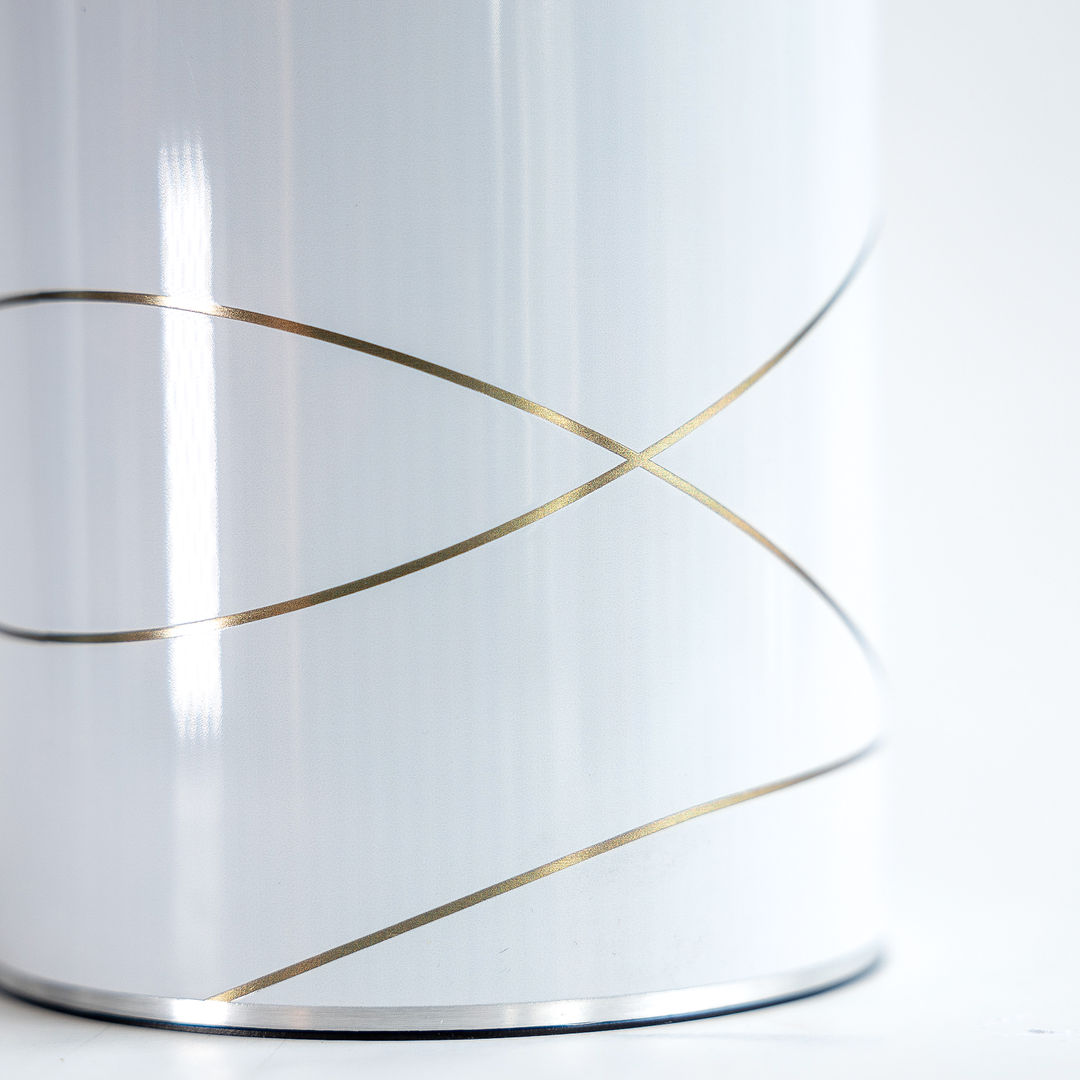 Close up of the coolenator wine cooler gold and white design.