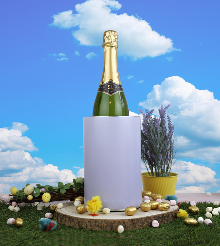 Coolenator wine cooler purple pastel color in outdoor setting with chocolate easter eggs around it.
