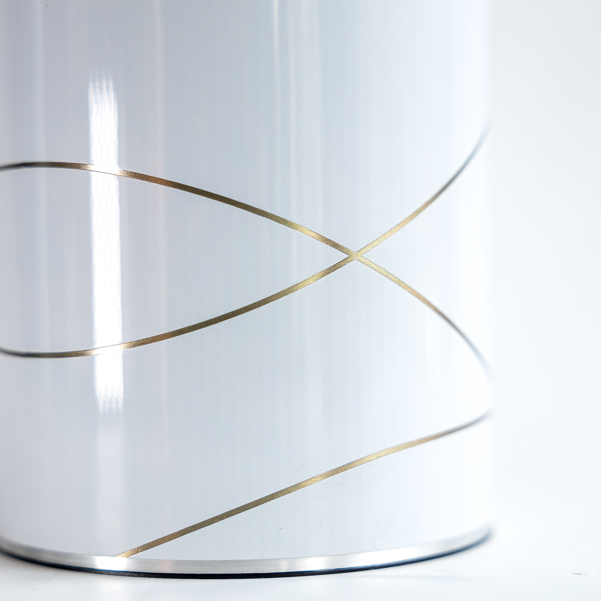 Close up of the coolenator wine cooler gold and white design. 